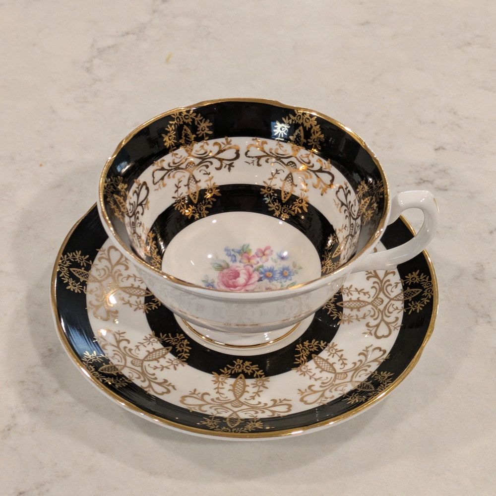 Royal Graftoy Luxury Black and Gold Floral Teacup and Saucer 1940s.
